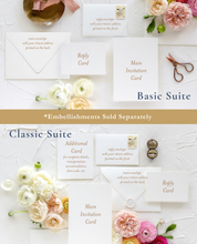 Load image into Gallery viewer, a white table topped with flowers and cards